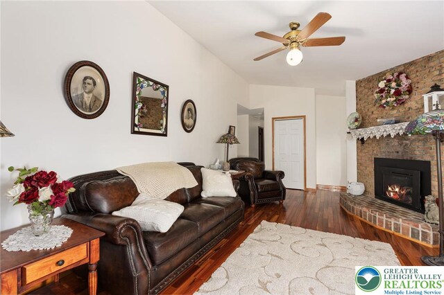 7438 Rte 309, Lynn Twp, PA 18066 - living room with wood finished floors, lofted ceiling, a ceiling fan, and a fireplace