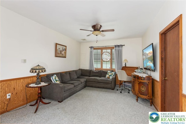 7438 Rte 309, Lynn Twp, PA 18066 - carpeted living room with a wainscoted wall, ceiling fan, and wooden walls