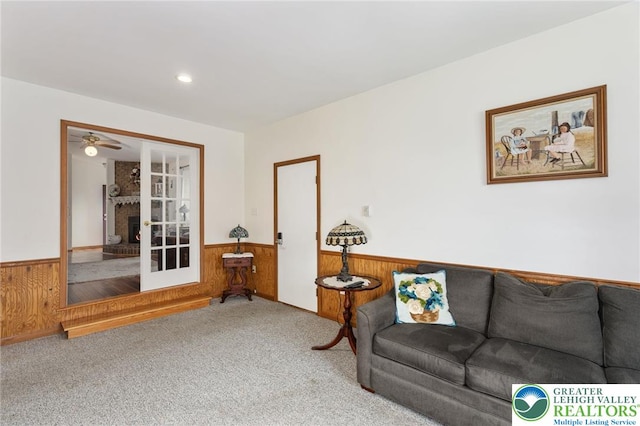 7438 Rte 309, Lynn Twp, PA 18066 - living room with a wainscoted wall, wooden walls, and carpet flooring