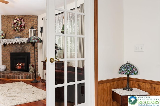 7438 Rte 309, Lynn Twp, PA 18066 - detailed view of a wainscoted wall, wood finished floors, a fireplace, and wooden walls