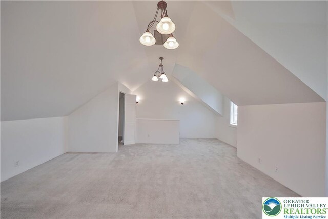 5758 Lower Macungie Rd, Lower Macungie Twp, PA 18062 - bonus room with carpet floors, lofted ceiling, and a chandelier