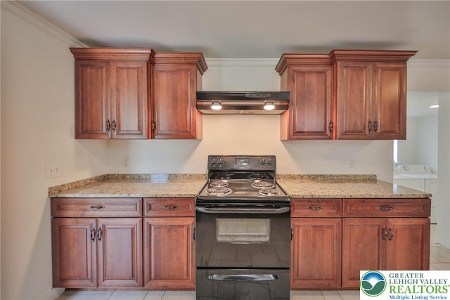 5758 Lower Macungie Rd, Lower Macungie Twp, PA 18062 - kitchen with black / electric stove, washer and dryer, under cabinet range hood, light stone countertops, and ornamental molding