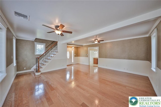 5758 Lower Macungie Rd, Lower Macungie Twp, PA 18062 - unfurnished living room featuring a ceiling fan, stairway, and light wood-style flooring