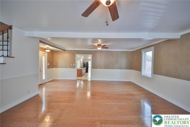 5758 Lower Macungie Rd, Lower Macungie Twp, PA 18062 - unfurnished living room featuring ceiling fan, light wood-type flooring, and beam ceiling