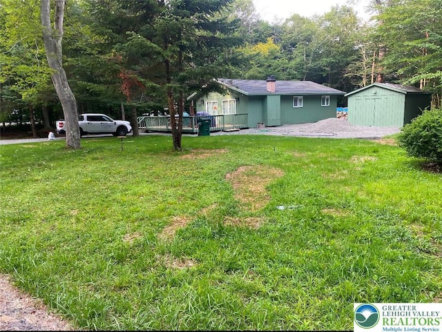 9379 Fairmount, Coolbaugh Twp, PA 18466 - view of grassy yard with a storage unit