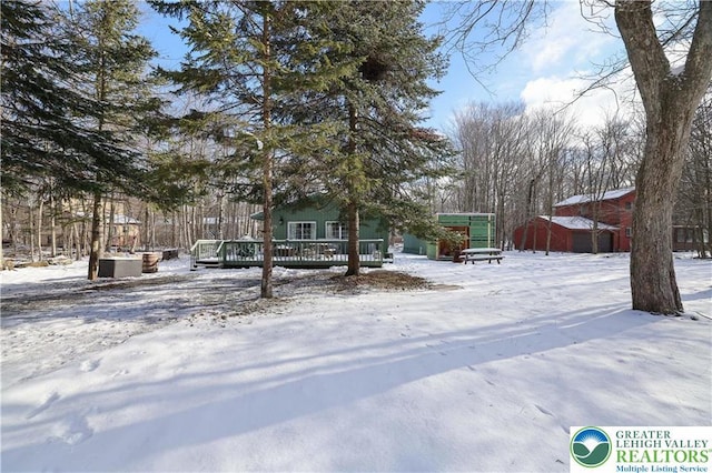 9379 Fairmount, Coolbaugh Twp, PA 18466 - view of front facade with a deck and an outbuilding