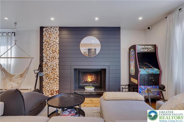 9379 Fairmount, Coolbaugh Twp, PA 18466 - living area featuring a large fireplace, recessed lighting, and wood finished floors