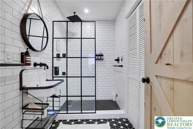 9379 Fairmount, Coolbaugh Twp, PA 18466 - full bath with a stall shower, tile walls, a closet, and tile patterned flooring
