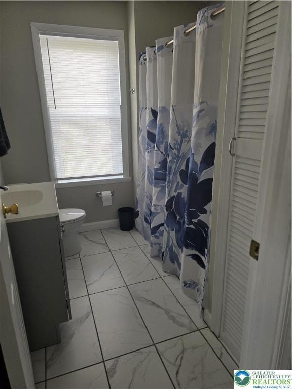 1523 Cedar St, Northampton Boro, PA 18067 - bathroom with marble finish floors, vanity, a closet, and a shower with curtain
