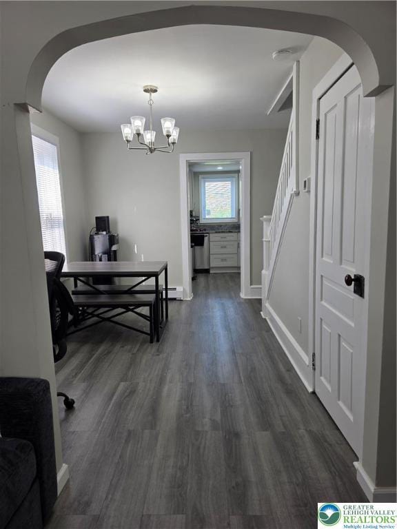 1523 Cedar St, Northampton Boro, PA 18067 - dining area with arched walkways, dark wood-type flooring, a desk, stairs, and a chandelier