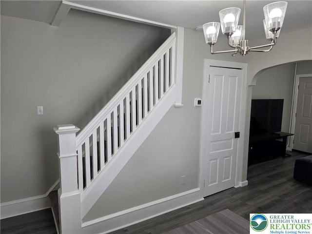 1523 Cedar St, Northampton Boro, PA 18067 - staircase with arched walkways, wood finished floors, and a chandelier