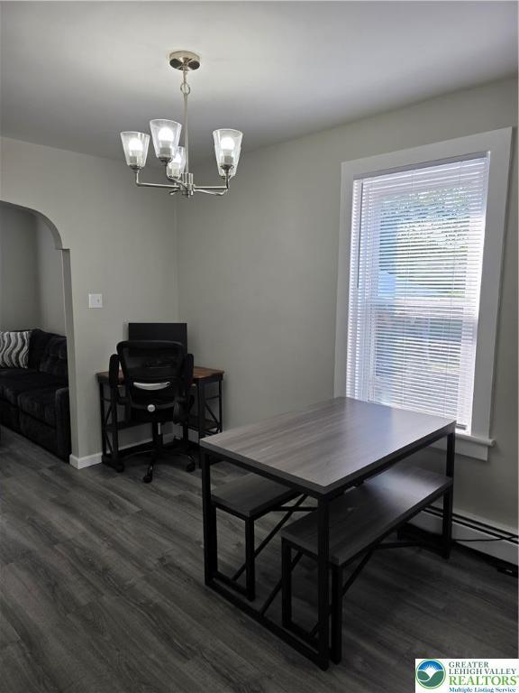 1523 Cedar St, Northampton Boro, PA 18067 - dining room with dark wood-style flooring, arched walkways, a chandelier, and a baseboard heating unit