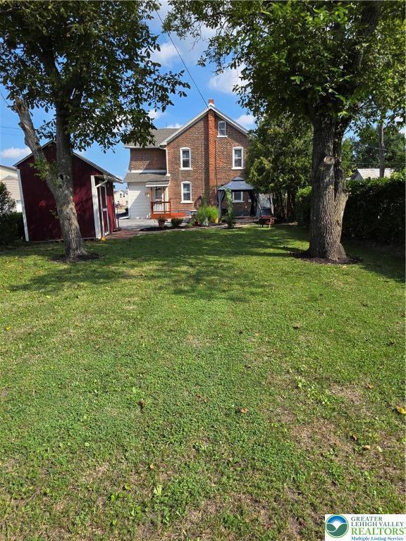 1523 Cedar St, Northampton Boro, PA 18067 - view of green lawn featuring a storage shed