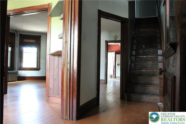 206 21st St, Northampton Boro, PA 18067 - corridor with radiator heating unit, stairs, and hardwood / wood-style floors