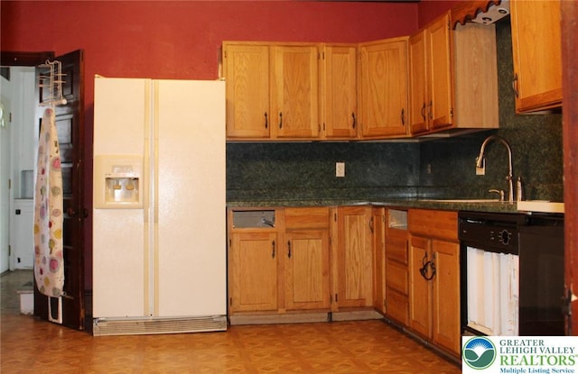 206 21st St, Northampton Boro, PA 18067 - kitchen featuring white fridge with ice dispenser, dishwasher, backsplash, and dark countertops