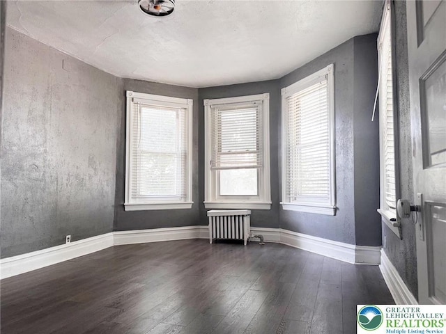 206 21st St, Northampton Boro, PA 18067 - empty room with wood-type flooring, healthy amount of natural light, and radiator