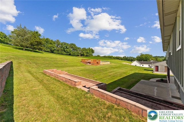 4661 Hillside Rd, Coplay Boro, PA 18037 - view of grassy yard featuring a patio area