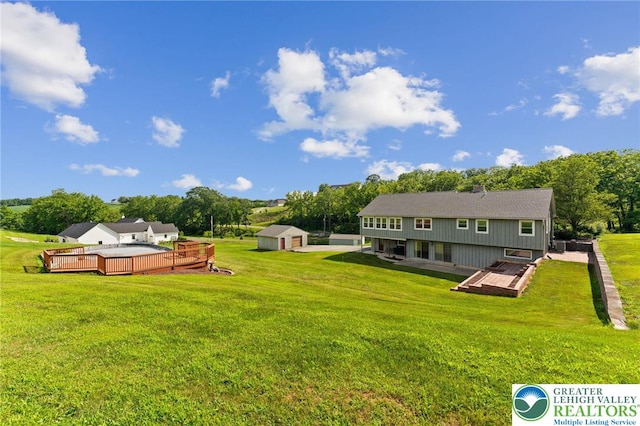 4661 Hillside Rd, Coplay Boro, PA 18037 - back of property with a wooden deck, a storage shed, and a yard