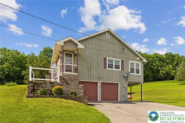 4661 Hillside Rd, Coplay Boro, PA 18037 - view of front of house with an attached garage, driveway, and a front lawn