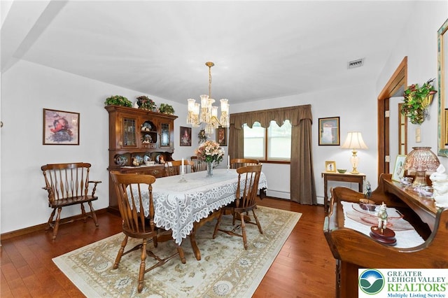 4661 Hillside Rd, Coplay Boro, PA 18037 - dining room featuring a chandelier, hardwood / wood-style floors, and a baseboard heating unit