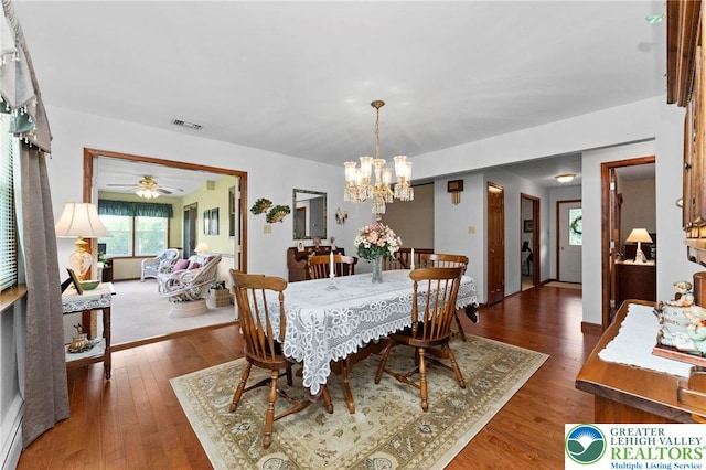 4661 Hillside Rd, Coplay Boro, PA 18037 - dining area with a chandelier, wood finished floors, ceiling fan, and baseboard heating