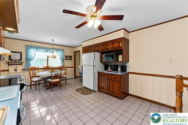 4661 Hillside Rd, Coplay Boro, PA 18037 - kitchen with freestanding refrigerator, stainless steel microwave, a ceiling fan, light countertops, and pendant lighting