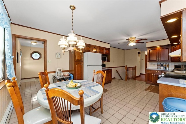 4661 Hillside Rd, Coplay Boro, PA 18037 - dining space featuring ceiling fan, light tile patterned floors, a chandelier, a baseboard heating unit, and crown molding