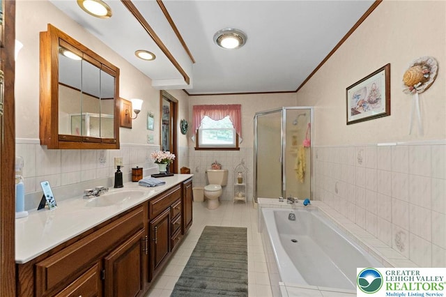 4661 Hillside Rd, Coplay Boro, PA 18037 - bathroom with tile walls, vanity, a shower stall, a bath, and tile patterned floors