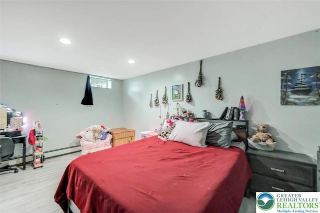 5117 Hounds Ear Rd, Coolbaugh Twp, PA 18466 - bedroom featuring wood finished floors, recessed lighting, and a baseboard heating unit