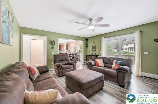 5117 Hounds Ear Rd, Coolbaugh Twp, PA 18466 - living room featuring wood finished floors and a ceiling fan