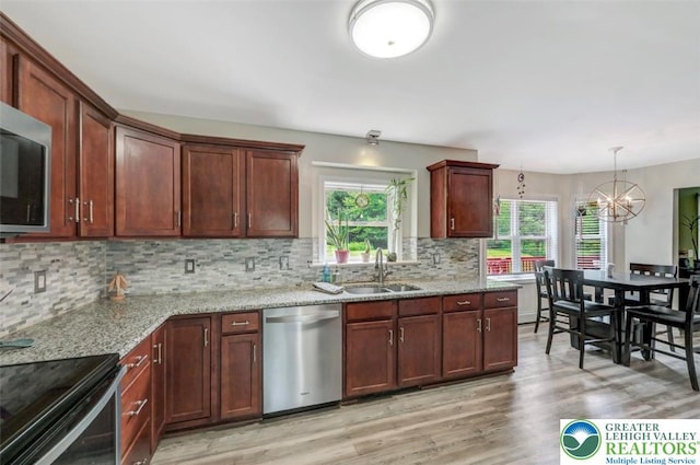 5117 Hounds Ear Rd, Coolbaugh Twp, PA 18466 - kitchen with dishwasher, light wood-style floors, plenty of natural light, and a chandelier