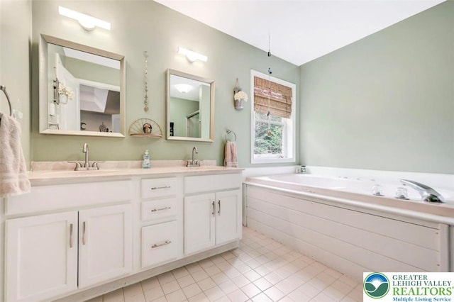 5117 Hounds Ear Rd, Coolbaugh Twp, PA 18466 - full bathroom with double vanity, tile patterned floors, and a garden tub