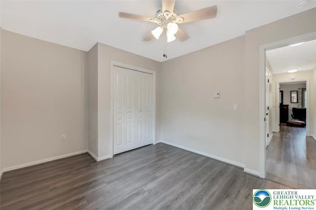 5117 Hounds Ear Rd, Coolbaugh Twp, PA 18466 - unfurnished bedroom featuring wood finished floors, a closet, and a ceiling fan