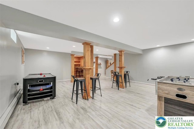 5117 Hounds Ear Rd, Coolbaugh Twp, PA 18466 - game room with wood finished floors, a baseboard radiator, recessed lighting, and bar area