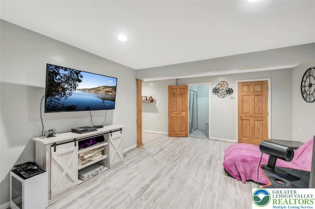 5117 Hounds Ear Rd, Coolbaugh Twp, PA 18466 - living room with light wood-style flooring and recessed lighting
