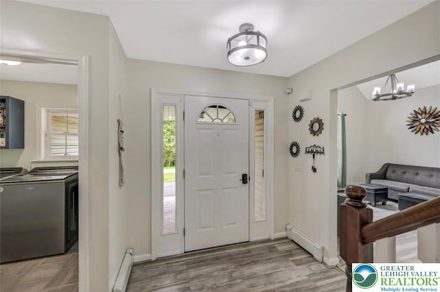 5117 Hounds Ear Rd, Coolbaugh Twp, PA 18466 - foyer entrance with a baseboard heating unit, healthy amount of natural light, and independent washer and dryer