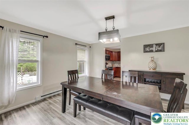 5117 Hounds Ear Rd, Coolbaugh Twp, PA 18466 - dining area featuring baseboard heating and light wood finished floors