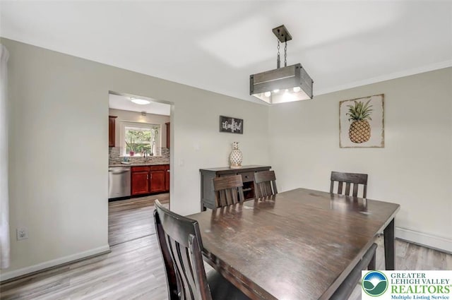 5117 Hounds Ear Rd, Coolbaugh Twp, PA 18466 - dining area featuring light wood finished floors and baseboard heating