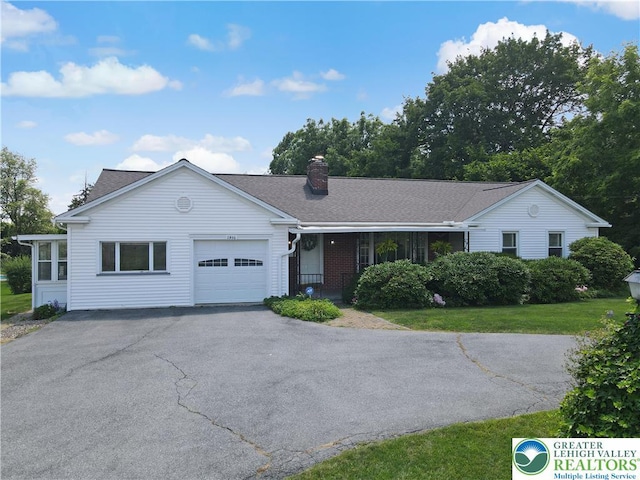 2930 Green Pond, Palmer Twp, PA 18045 - ranch-style house with a garage, driveway, a chimney, covered porch, and a front yard