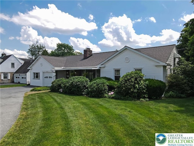 2930 Green Pond, Palmer Twp, PA 18045 - view of front of property featuring an attached garage, asphalt driveway, a front yard, and a chimney