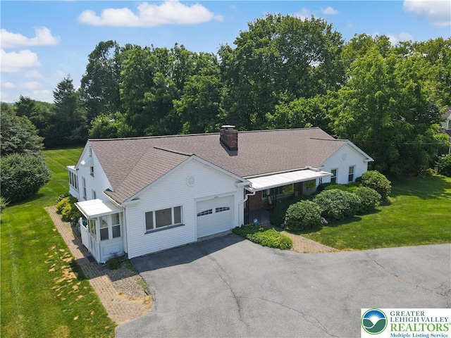 2930 Green Pond, Palmer Twp, PA 18045 - view of front of property featuring an attached garage, asphalt driveway, a front lawn, and a chimney