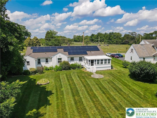 2930 Green Pond, Palmer Twp, PA 18045 - rear view of property featuring roof mounted solar panels and a lawn