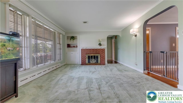 2930 Green Pond, Palmer Twp, PA 18045 - unfurnished living room with a baseboard heating unit, plenty of natural light, arched walkways, crown molding, and a fireplace