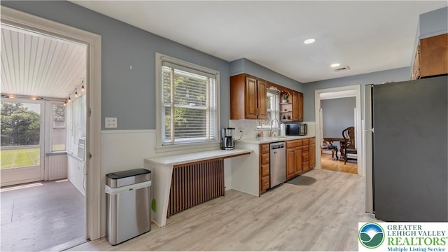 2930 Green Pond, Palmer Twp, PA 18045 - kitchen featuring appliances with stainless steel finishes, radiator, brown cabinetry, light countertops, and light wood-style flooring