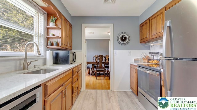 2930 Green Pond, Palmer Twp, PA 18045 - kitchen with appliances with stainless steel finishes, light wood-type flooring, open shelves, light stone countertops, and brown cabinetry