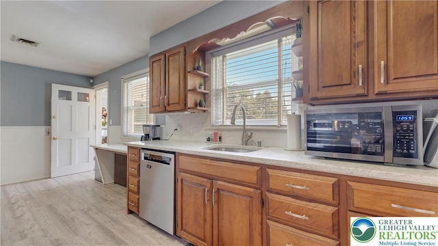 2930 Green Pond, Palmer Twp, PA 18045 - kitchen with appliances with stainless steel finishes, brown cabinets, light wood-style flooring, and open shelves
