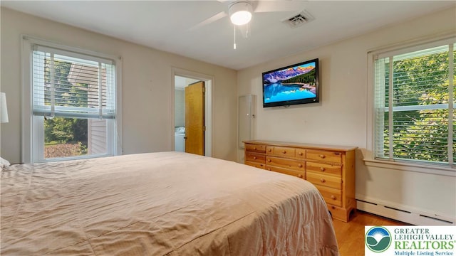 2930 Green Pond, Palmer Twp, PA 18045 - bedroom with baseboard heating, wood finished floors, and ceiling fan