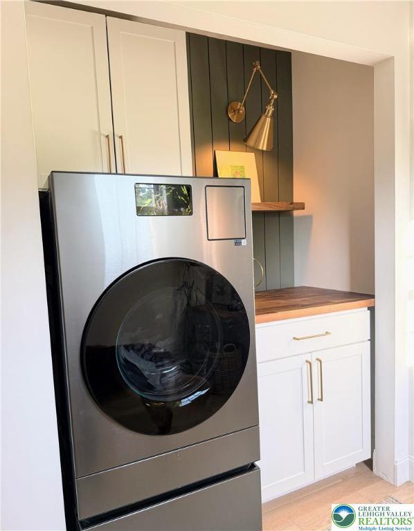 12 Concord Ct, Easton, PA 18040 - washroom featuring washer / clothes dryer, cabinet space, and light wood-style floors