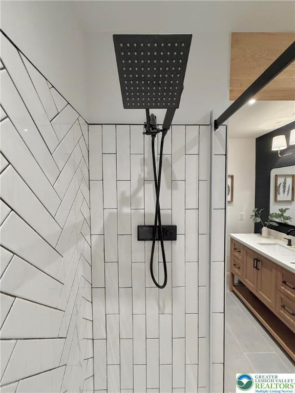 12 Concord Ct, Easton, PA 18040 - bathroom featuring vanity, a tile shower, and tile patterned floors