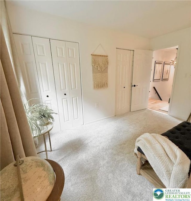 12 Concord Ct, Easton, PA 18040 - living area featuring an upstairs landing and carpet flooring
